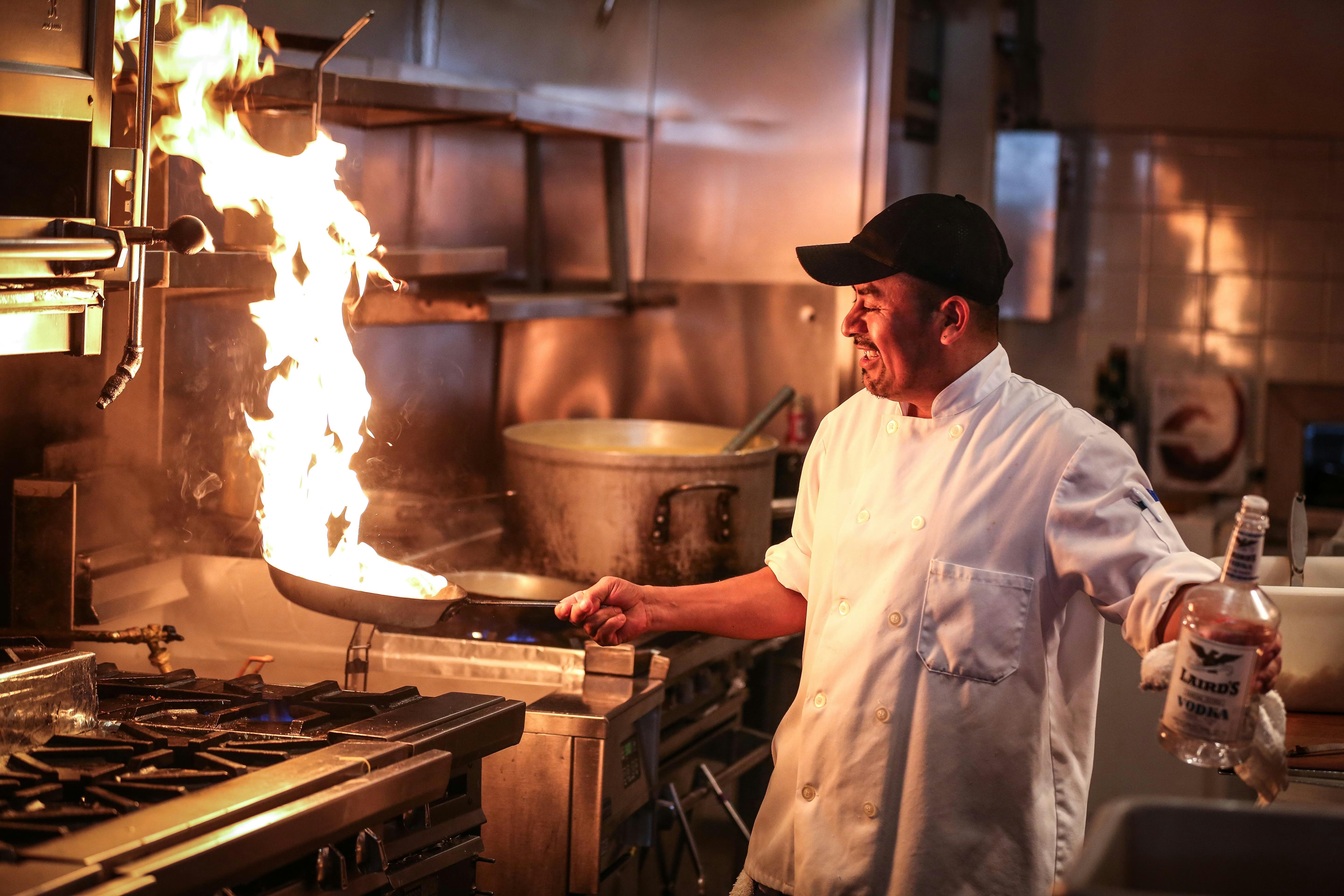 Chef cooking with flames